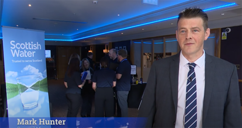 Mark Hunter, General Manager of Development and Operational Services, in a suit, at Scottish Water at the Annual Development Forum 2025