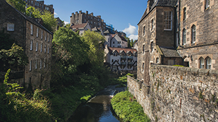 General view of the Waters of Leith in Edinburgh with historic buildings on its banks